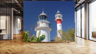 Two lighthouses together on the Spanish coast. The ancient and the modern together. Sunny day in El Rompido, Huelva, Andalusia, Spain Wall mural