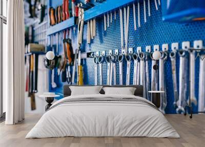 Detail of motorcycle workshop tools board with wrenches in the foreground Wall mural