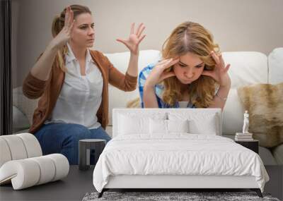 furious mother arguing with her ​​teenage daughter Wall mural