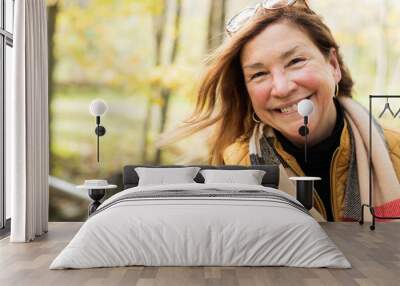 candid portrait of happy woman in autumn Wall mural