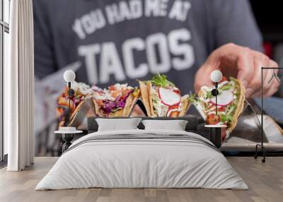 man eating tacos in summer Wall mural