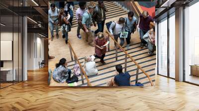 Elevated view of university students walking up and down stairs Wall mural