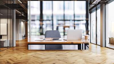 Shot of light cozy laptop computer office interior in modern minimalist style with working desks and plants, copy space Wall mural