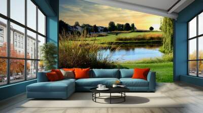 Peaceful view of a golf course during sunset Wall mural