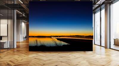 Water landscape with dark blue sky and fleeting light of cars in motion dusk sunset
 Wall mural