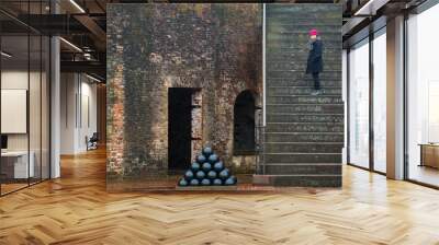 Woman at Civil War Fort standing on stairs Wall mural