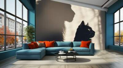 A cat sits in soft lighting, casting a shadow of a powerful lion, symbolizing inner strength, ambition, and confidence. Wall mural