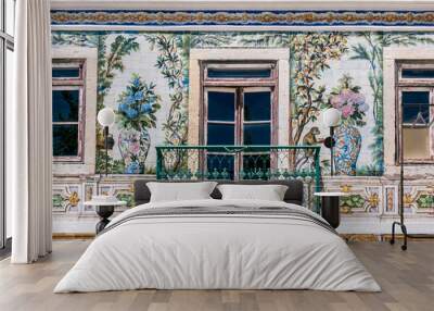 Balcony of a typical house in Portugal, decorated with ceramics that have flowers, fruits and animals, in Lisbon Wall mural