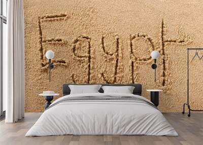 Egypt word written in sand on a sunny egyptian summer beach holiday vacation travel destination sign writing message photo Wall mural