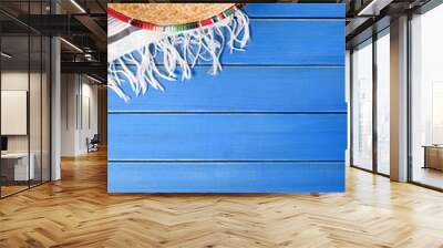 mexican background with sombrero and traditional serape rug or blanket on old blue wood planked back Wall mural