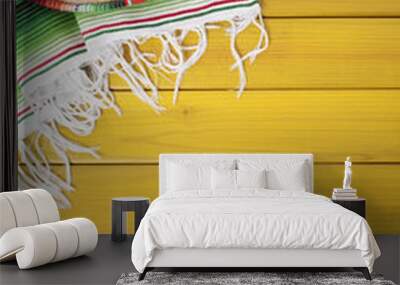 mexican background with sombrero straw hat and traditional serape rug or blanket on old planked pine Wall mural