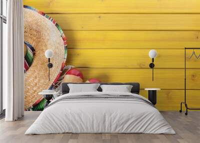 mexican background with sombrero straw hat maracas and traditional serape rug or blanket on old plan Wall mural