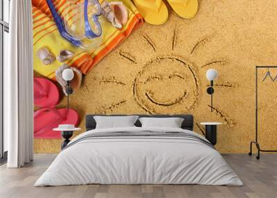 smiling sun happy smiley face drawing drawn in sand with child hands on a tropical beach with seashe Wall mural