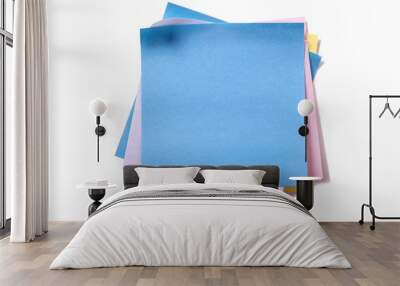 Untidy pile various different colors square sticky post it note blue on top isolated on white background photo Wall mural