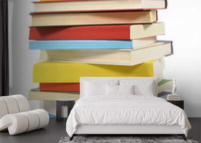 Very tall pile stack of various several lots books isolated on white background photo Wall mural