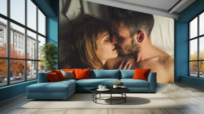 Couple in love having a romantic moment in the beedrom. Sensual boyfriend and girlfriend having sex at morning in the bed. Wall mural