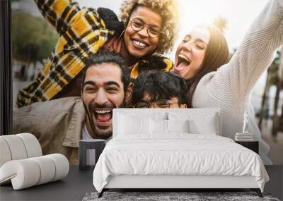 Group of four best friends laughing out loud outside - Multicultural young people enjoying day out together - Youth culture concept with guys and girls having fun on city street  Wall mural