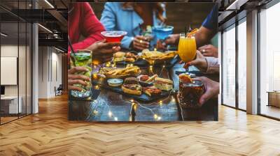 Group of people drinking alcohol and eating appetizers sitting at cocktail bar - Friends enjoying happy hour at brewery pub restaurant - Food and beverage life style concept Wall mural