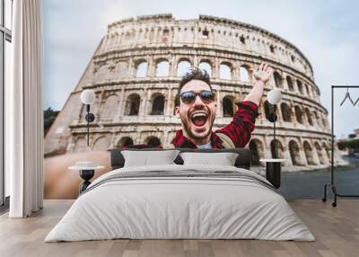 Happy tourist visiting Colosseum in Rome, Italy - Young man taking selfie in front of famous Italian landmark - Travel and holidays concept Wall mural