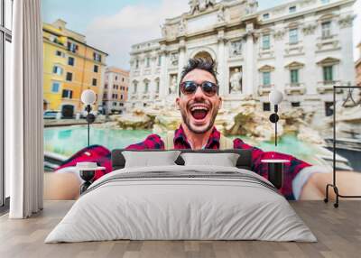 Happy young tourist taking selfie in front of Trevi Fountain during summer vacation in Italy - Happy man enjoying summertime holiday in Europe - Travel and technology life style concept Wall mural