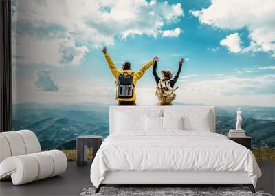 Hikers with backpacks jumping with arms up on top of a mountain - Couple of young happy travelers climbing the peak - Family, travel and adventure concept	
 Wall mural