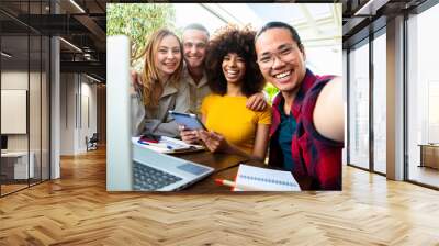 International young team work taking a selfie in creative office - Group of multiracial students using digital devices - Networking and e learning concept Wall mural