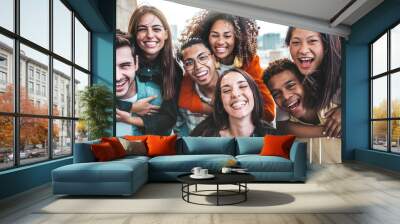 Multicultural young people smiling at camera outside - Happy friends having fun together on city street - University students standing together in college campus - Friendship and life style concept Wall mural