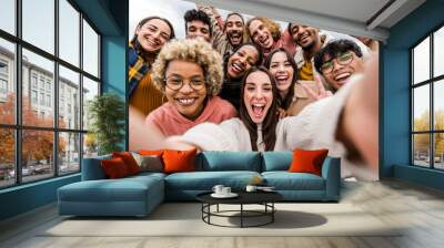 Multiracial friends taking big group selfie shot smiling at camera - Laughing young people standing outdoor and having fun - Cheerful students portrait outside school - Human resources concept Wall mural