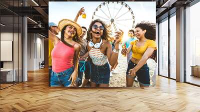 Multiracial group of friends having fun dancing on the beach - Happy people enjoying music festival on weekend vacation - Joyful tourists celebrating summer holiday together - Youth lifestyle concept Wall mural