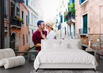 Romantic couple in love kissing in Venice, Italy - Tourists having fun on city street at holiday - People, love and holidays concept Wall mural