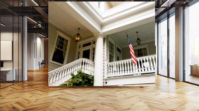 american flag outside white wooden american home porch in charleston south carolina Wall mural