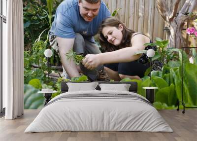 in the garden learning how to grow her own food. Wall mural