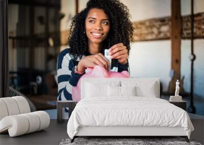 black woman with saving piggy bank Wall mural