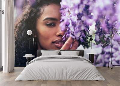 young black woman surrounded by flowers Wall mural