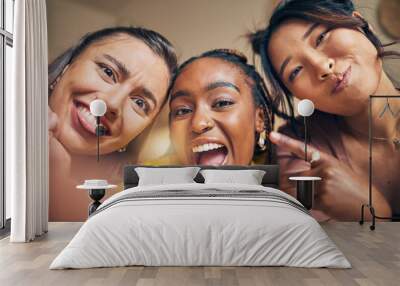 Friends, selfie and women happy, crazy and bond in a living room at home together on the weekend. Portrait, emoji and people with diversity pose for profile picture, blog or social media memory post Wall mural