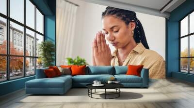 Hands, worship and woman praying in her living room for hope, help or holy forgiveness in her home. God, pray and Christian female in prayer for blessing, grace and gratitude to Jesus Christ in house Wall mural