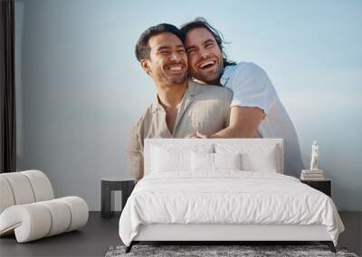 Love, hug and gay men with blue sky, embrace and smile on summer vacation together in Thailand. Sunshine, romance and marriage, happy lgbt couple relax in nature on island holiday with pride and fun. Wall mural