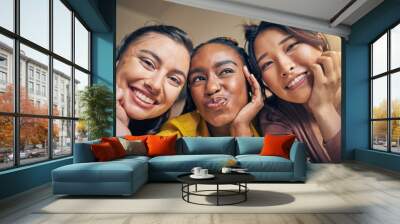 Selfie, friends and women happy, relax and bond in a living room at home together on the weekend. Portrait, smile and people with diversity pose for profile picture, blog or social media memory post Wall mural