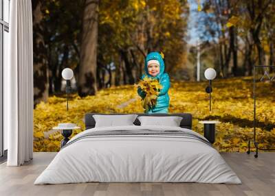 little girl throwing autumn leaves Wall mural