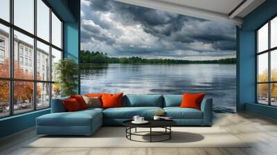 Dark storm clouds gathering over a calm lake Wall mural