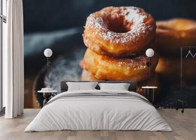 Glistening with sugary sweetness - apple cider donuts sit stacked on a plate - beckoning to be enjoyed alongside a cool glass of cider - wide format Wall mural