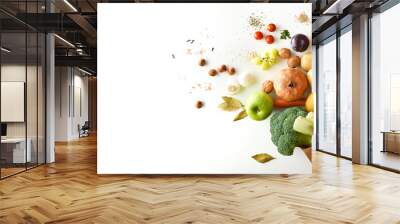 Background shopping bag with fruits and vegetables on white table Wall mural