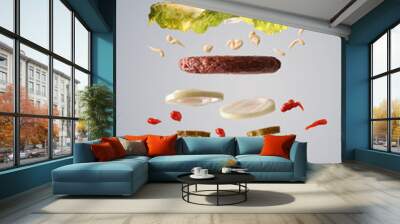 Double hamburger floating with lettuce onion and pickles gray background Wall mural