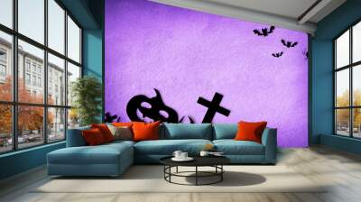 Halloween card with motifs in black and lilack background Wall mural