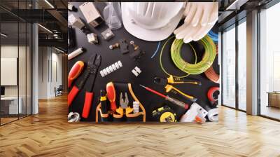 Industrial electricity tools on black table close up top Wall mural