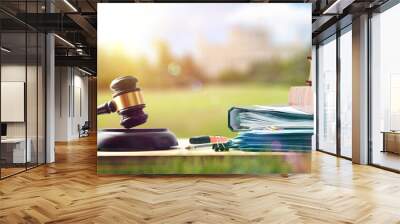 Law study material on wooden bench in college campus Wall mural