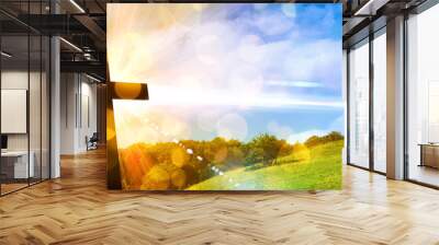 Religious representation with cross and nature landscape background Wall mural