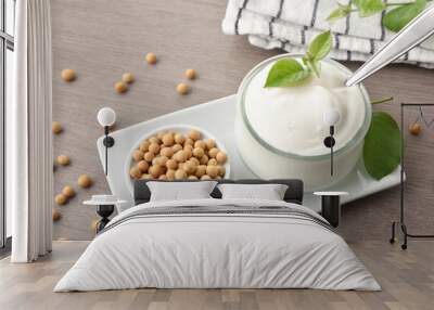 Soy yogurt and grains on plate on wooden bench Wall mural