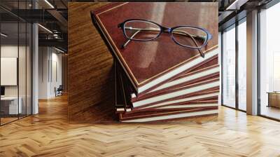 stack of books and glasses top view Wall mural