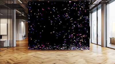 A fountain of colorful confetti falling on the floor on an black background Wall mural